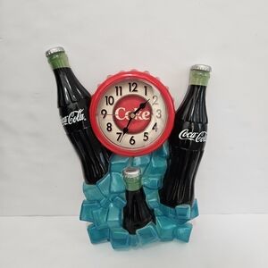 Coca-Cola clock with 3 coca cola bottles and ice cubes